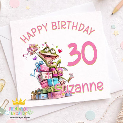 Square birthday card featuring an illustrated party frog surrounded by wrapped presents, personalised with the name Suzanne and age 30