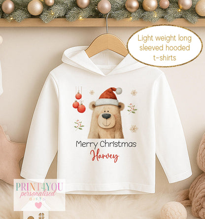 Personalised Christmas hooded t-shirt, white long sleeved hoodie printed with a bear in a red Santa hat, Merry Christmas and a name