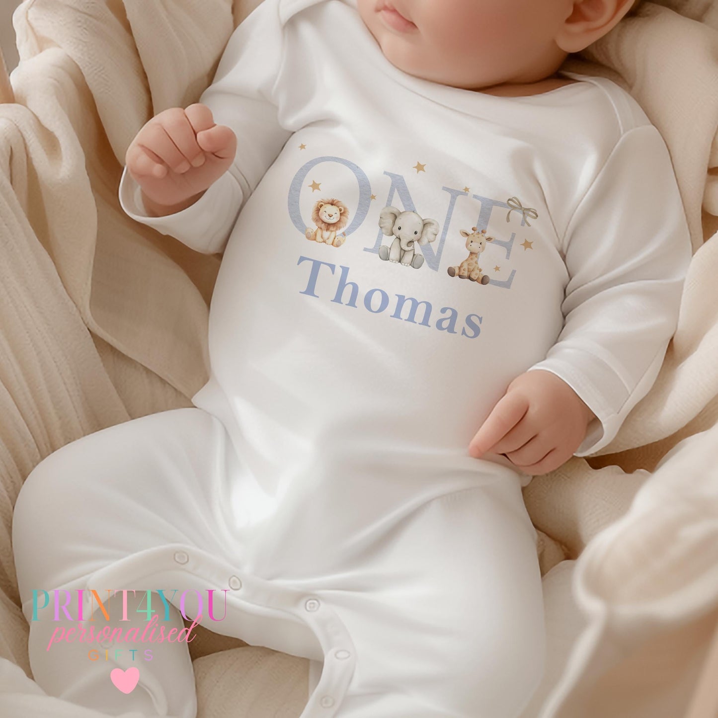 Personalised jungle safari first birthday vest with a giraffe, elephant and lion print and custom name.