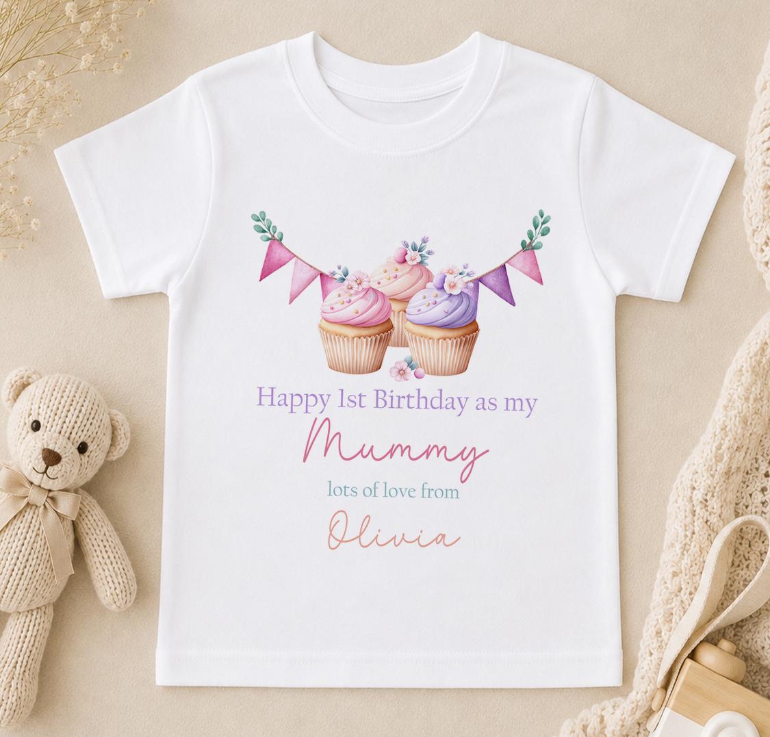 A white t-shirt with a birthday message printed on it, along with illustrations of cupcakes and a teddy bear.