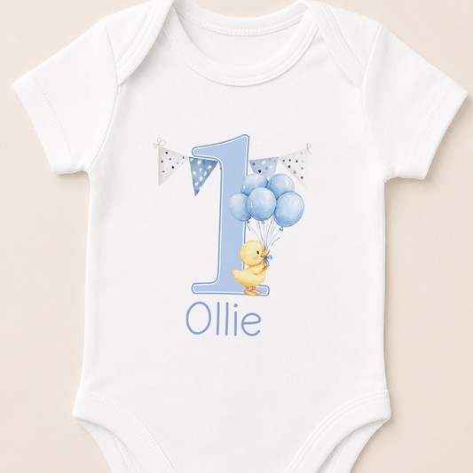 Personalised blue balloon duck first birthday onesie with a number one and your baby's name printed on the front.