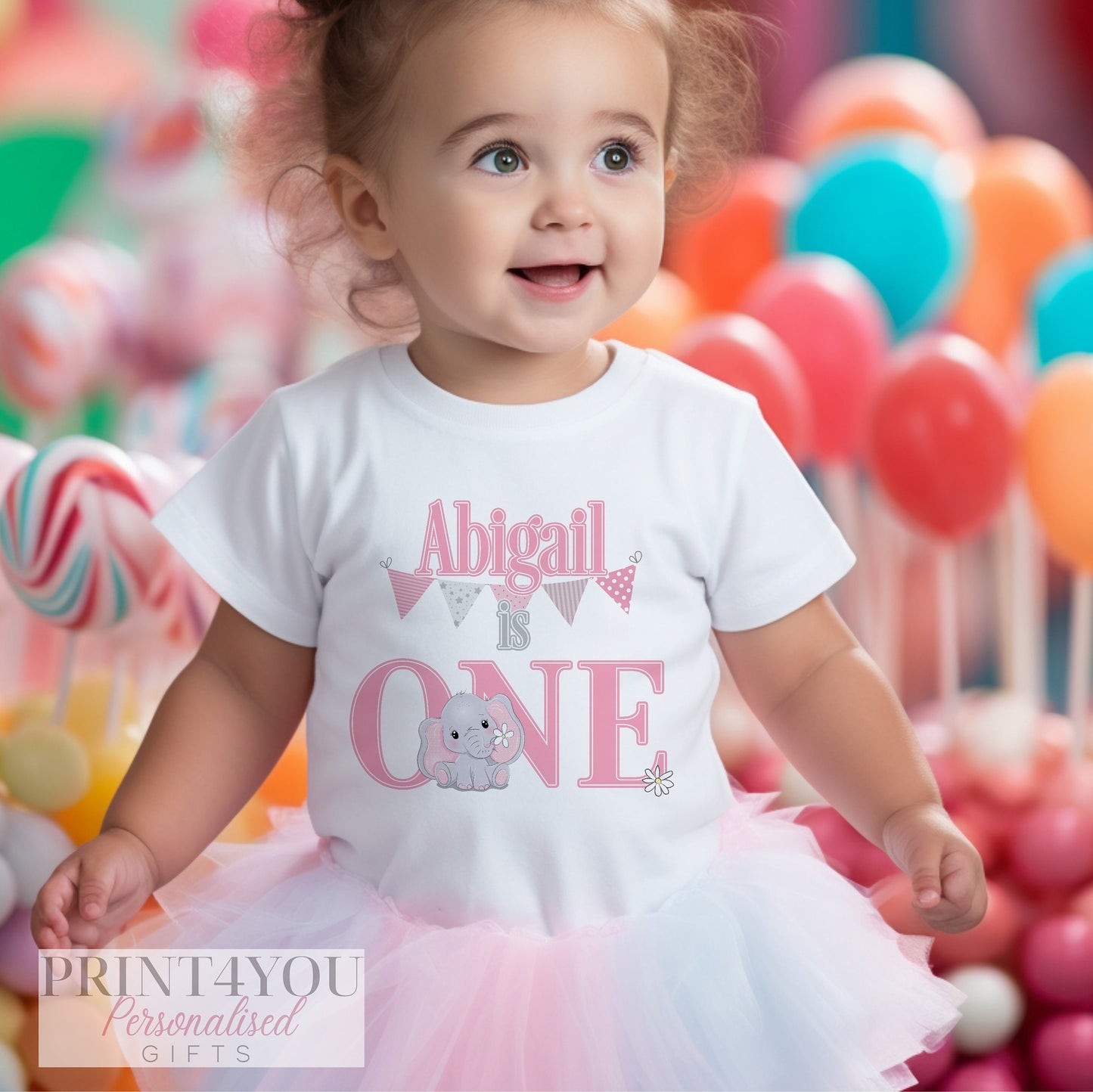Pink elephant sleepsuit personalised with baby's name, made from soft breathable cotton.