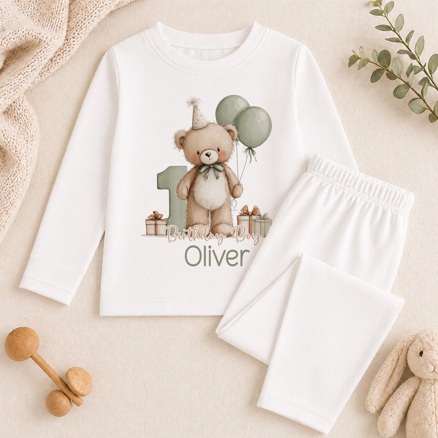 Personalised green teddy bear 1st birthday pyjamas with the child's name printed on soft cotton