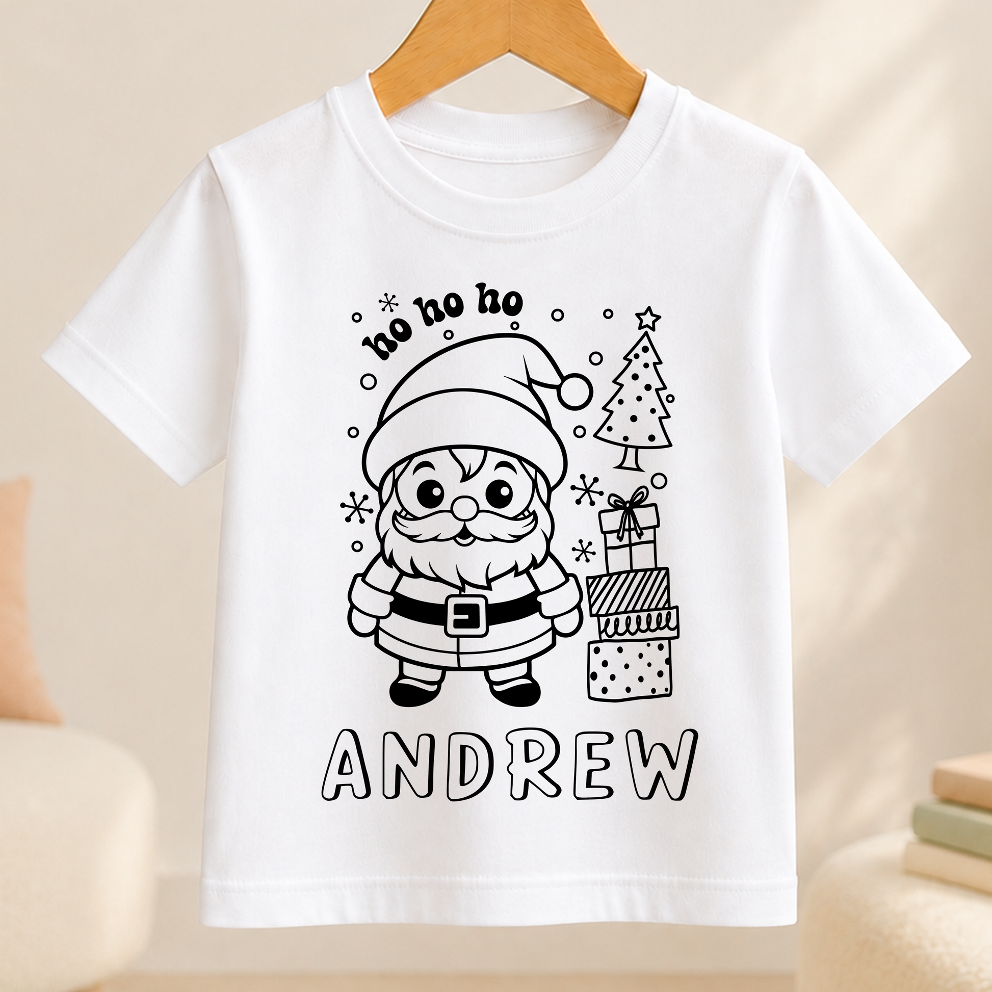 A white t-shirt with a black and white illustration of Santa Claus and Christmas decorations, along with the text "ho ho andrew" printed on it.