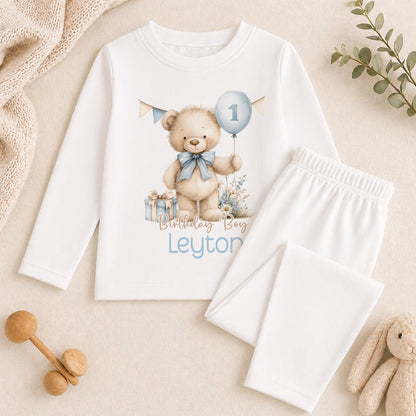 Personalised blue and beige teddy bear pyjamas for a baby boy's 1st birthday