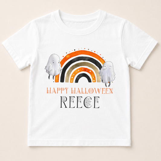 A white t-shirt with a Halloween-themed graphic design featuring two ghostly figures and a rainbow. The text on the t-shirt reads "Happy Halloween" and "Reece".