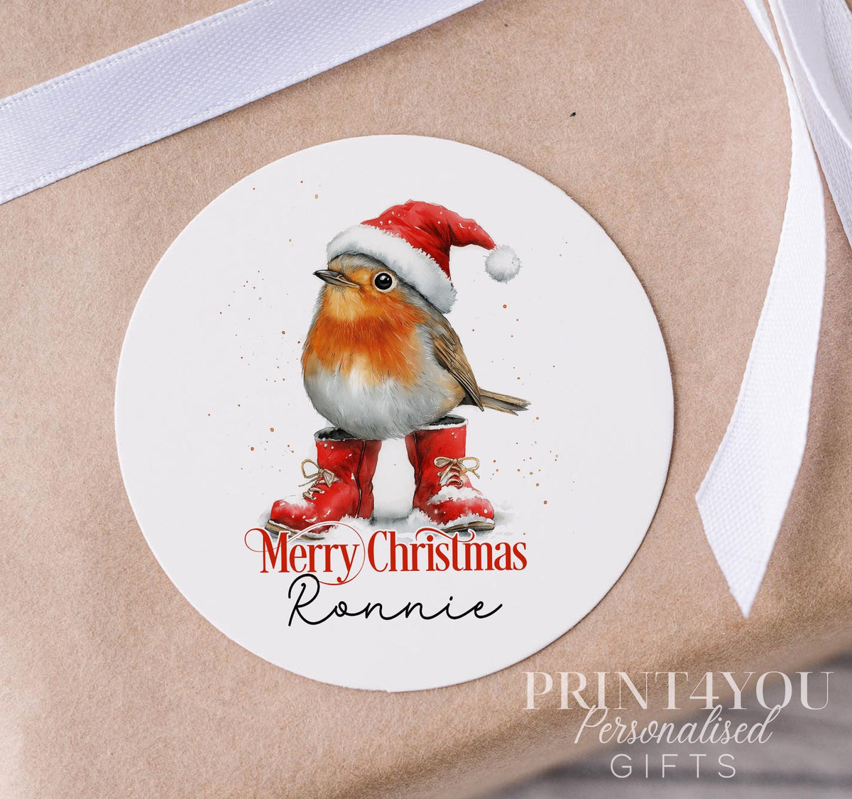 Personalised Christmas sticker on a strip, glossy white 5cm round gift label printed with a custom name