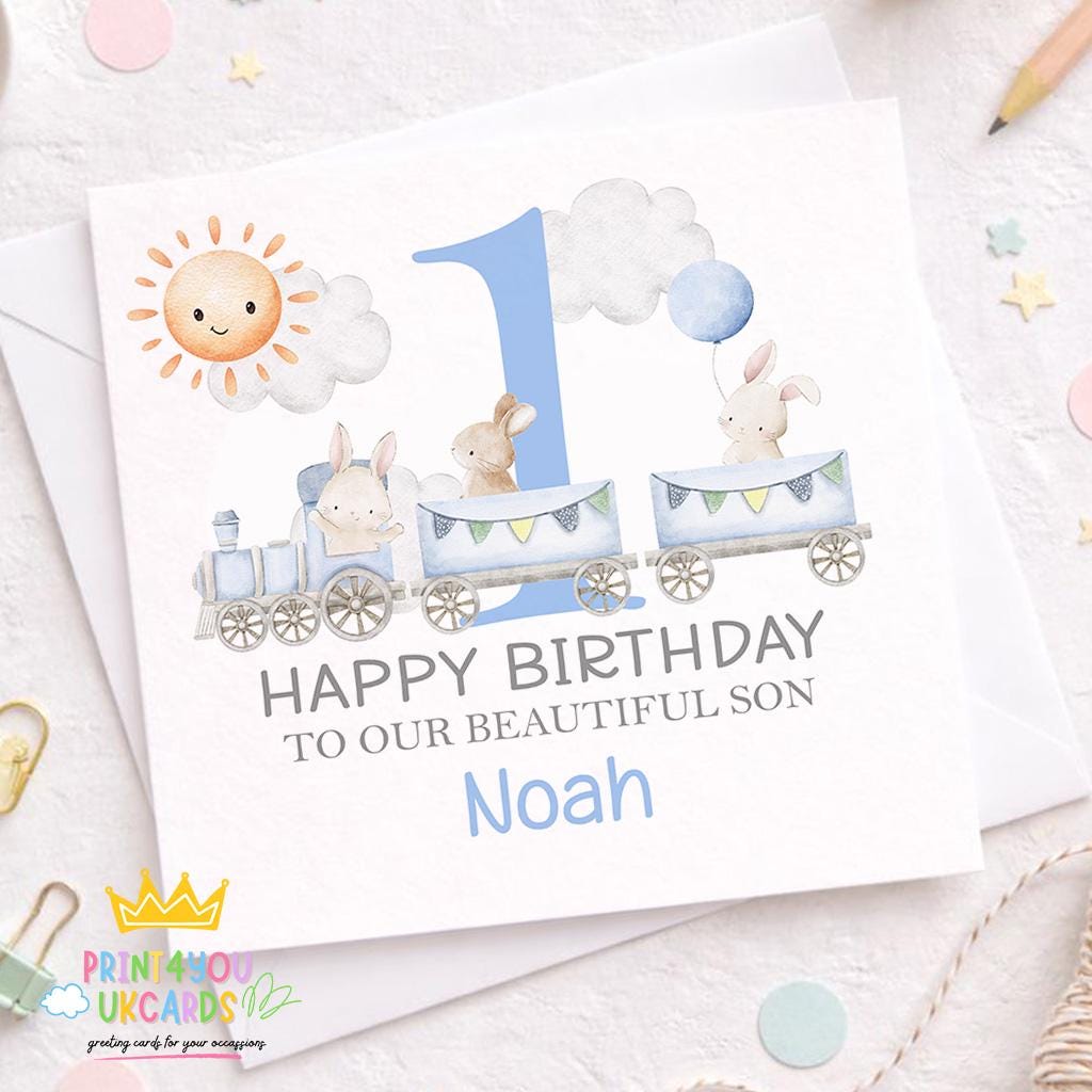 Square personalised first birthday card featuring a blue train and bunny design on a plain background
