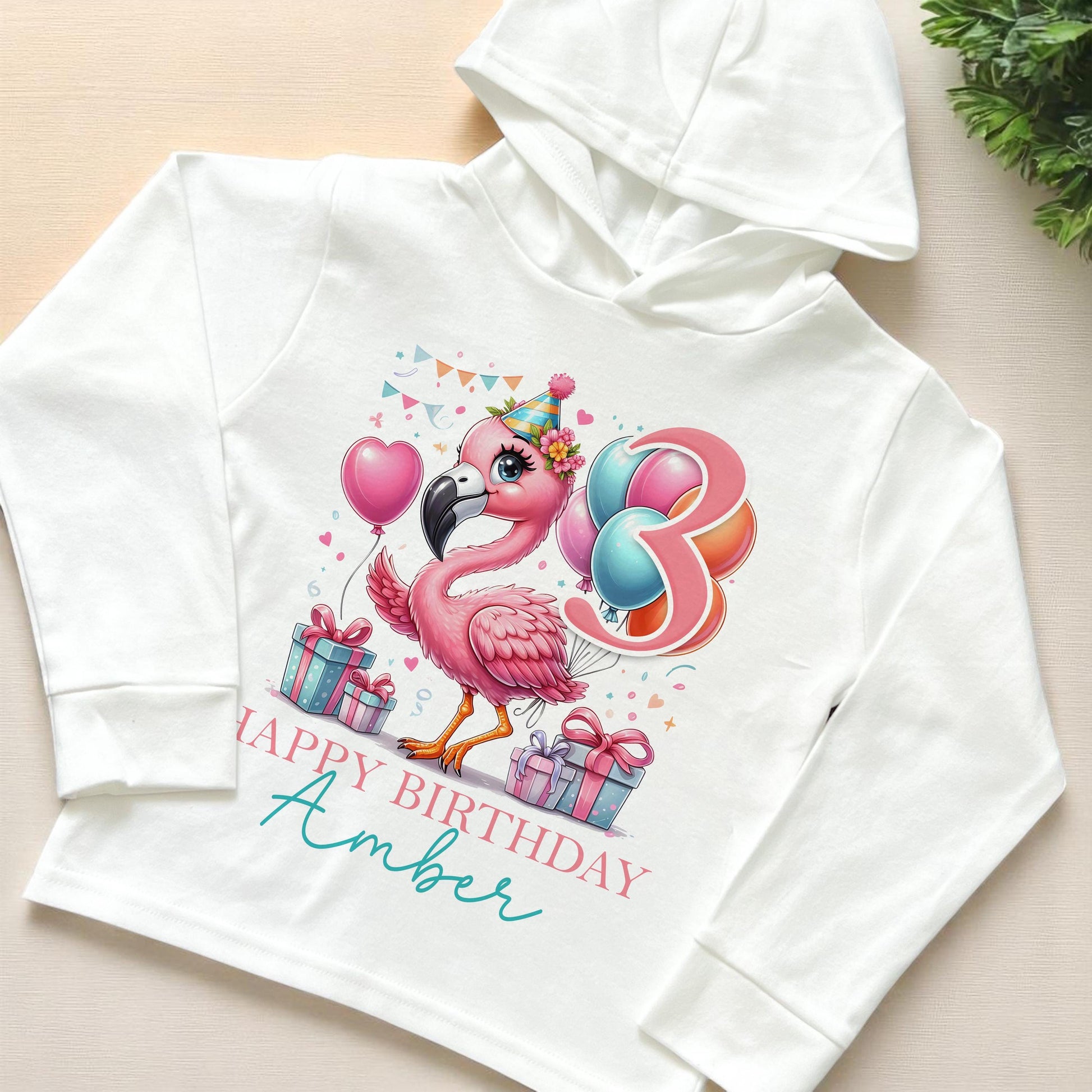 Personalised flamingo birthday number long-sleeved hooded t-shirt, 6-12 months size
