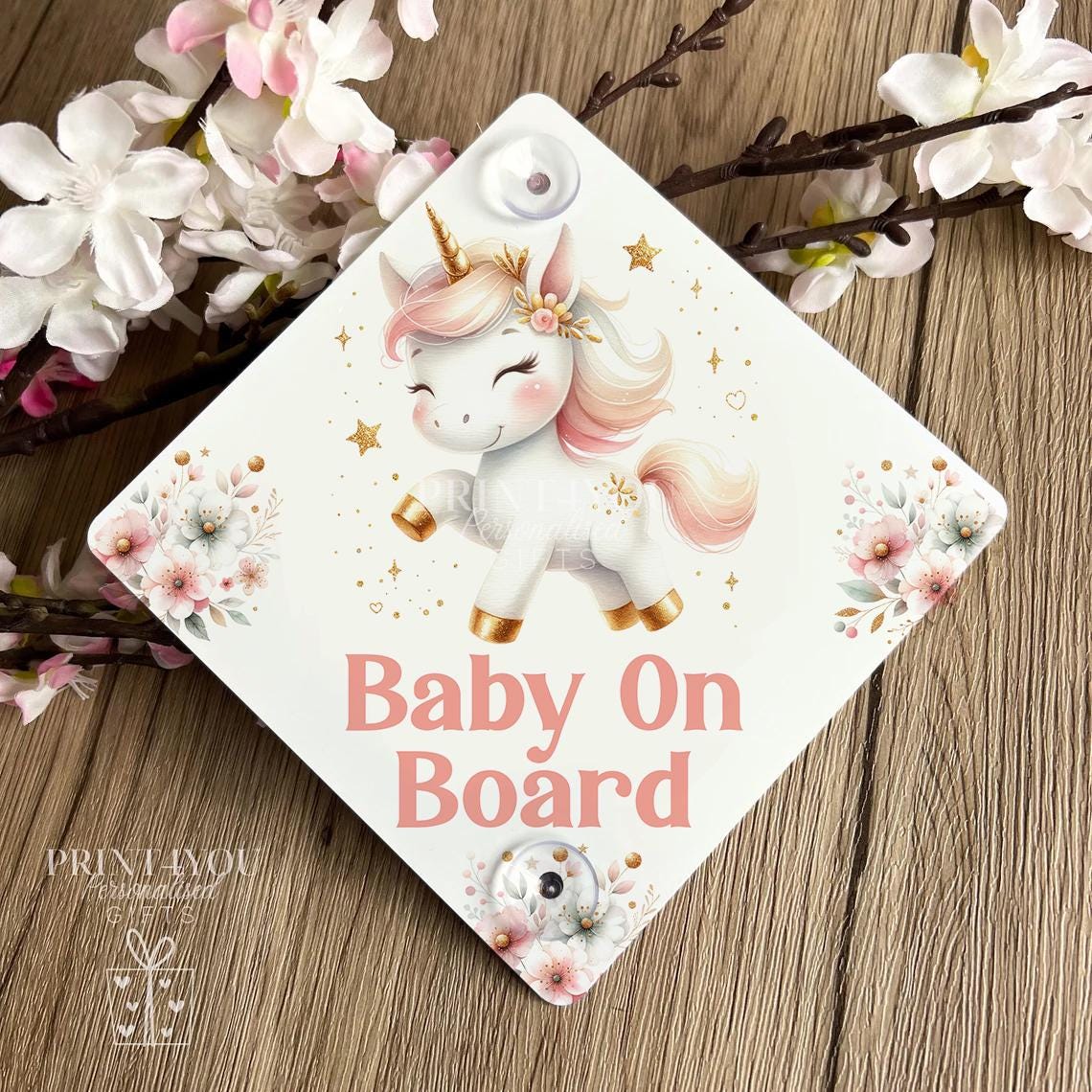 Baby on Board car sign, square aluminium plaque printed with a watercolour unicorn, pink flowers and gold stars above Baby On Board