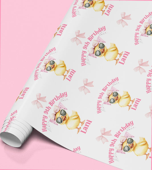 Pink wrapping paper with a repeating pattern of a yellow duck wearing sunglasses and a bow, printed with the text 'Happy 9th Birthday Lani'