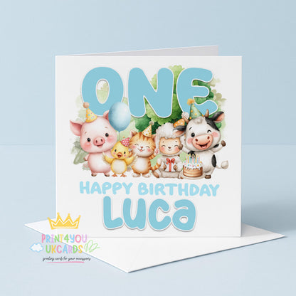 Square first birthday greeting card shown at an angle to display the farmyard animal design and card stock.