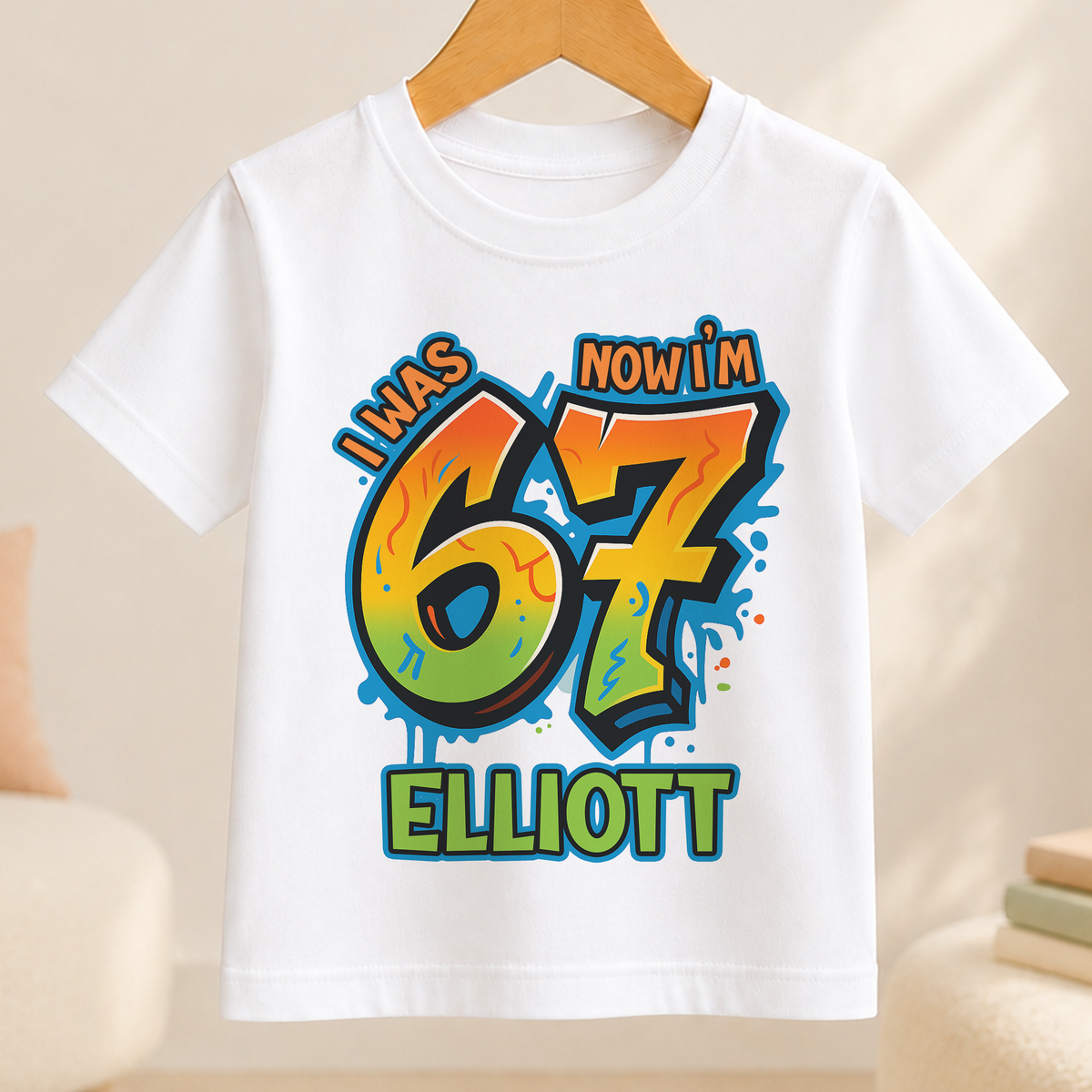White t-shirt with bold graffiti-style number 7 design personalised with the name Elliott for a boy's 7th birthday