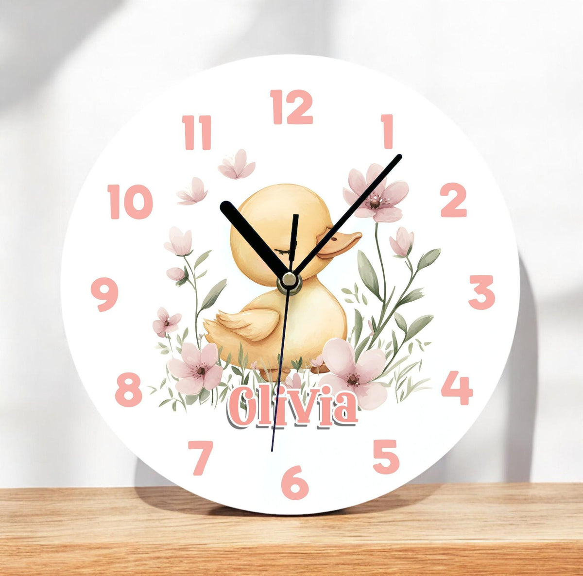Personalised yellow duck acrylic wall clock, 24.5cm, glossy white finish, customised with a child's name