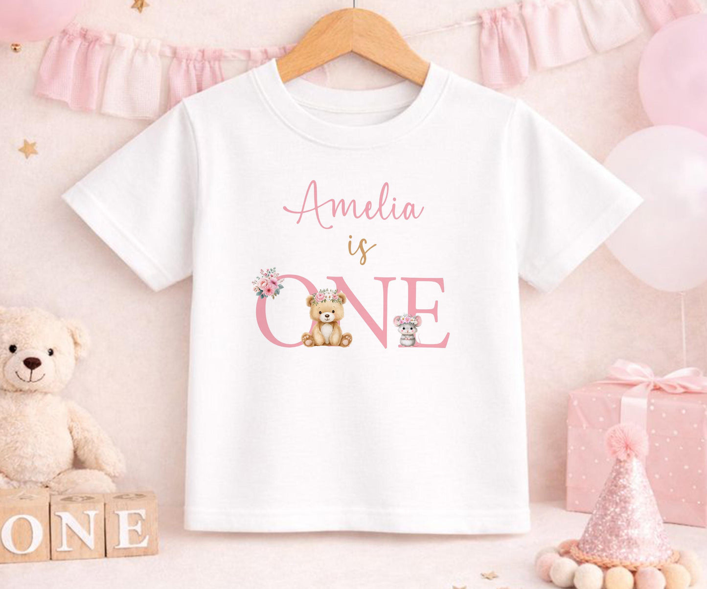 Personalised first birthday t-shirt with floral teddy bear design and custom name, soft cotton