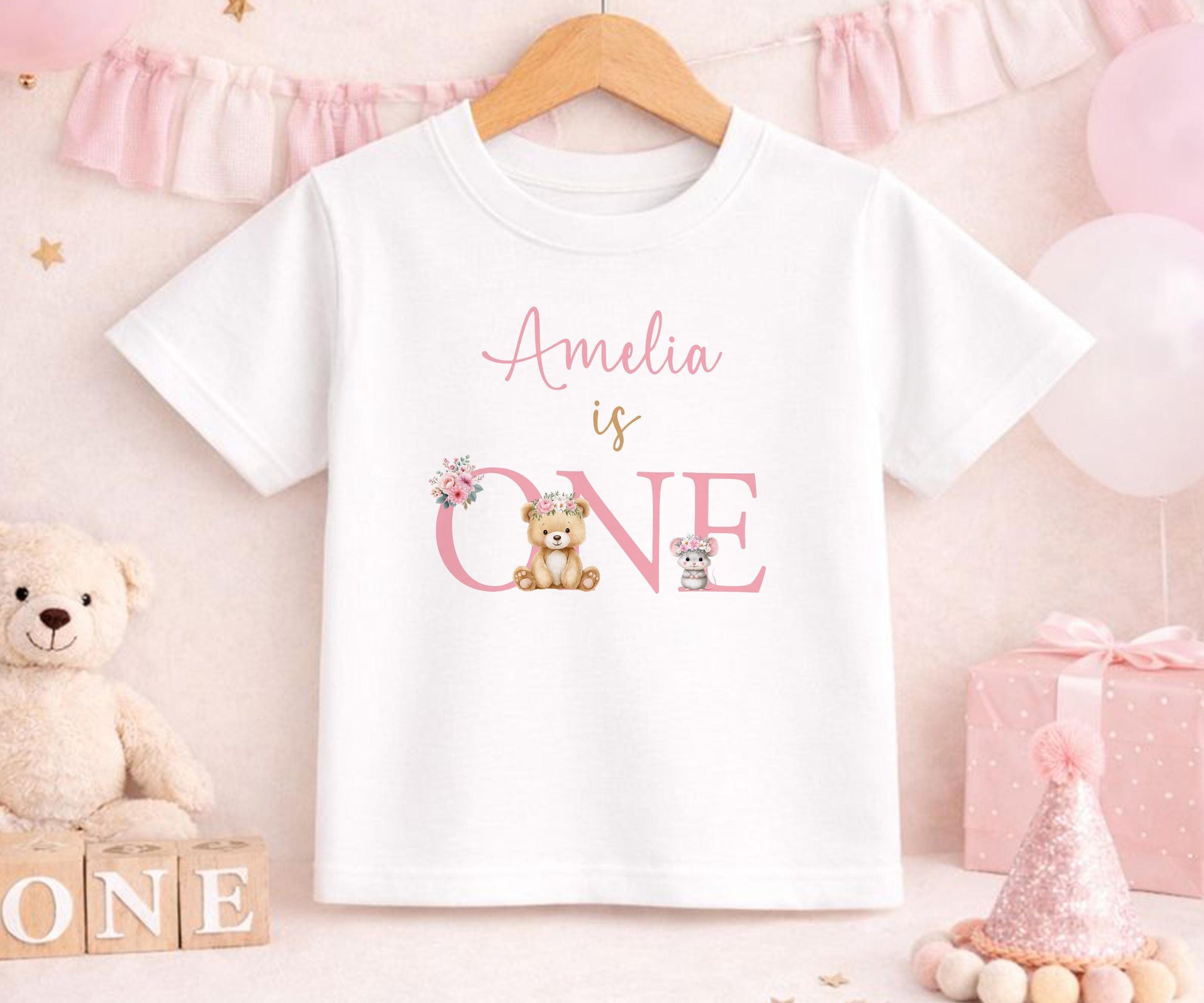 Personalised first birthday t-shirt with floral teddy bear design and custom name, soft cotton