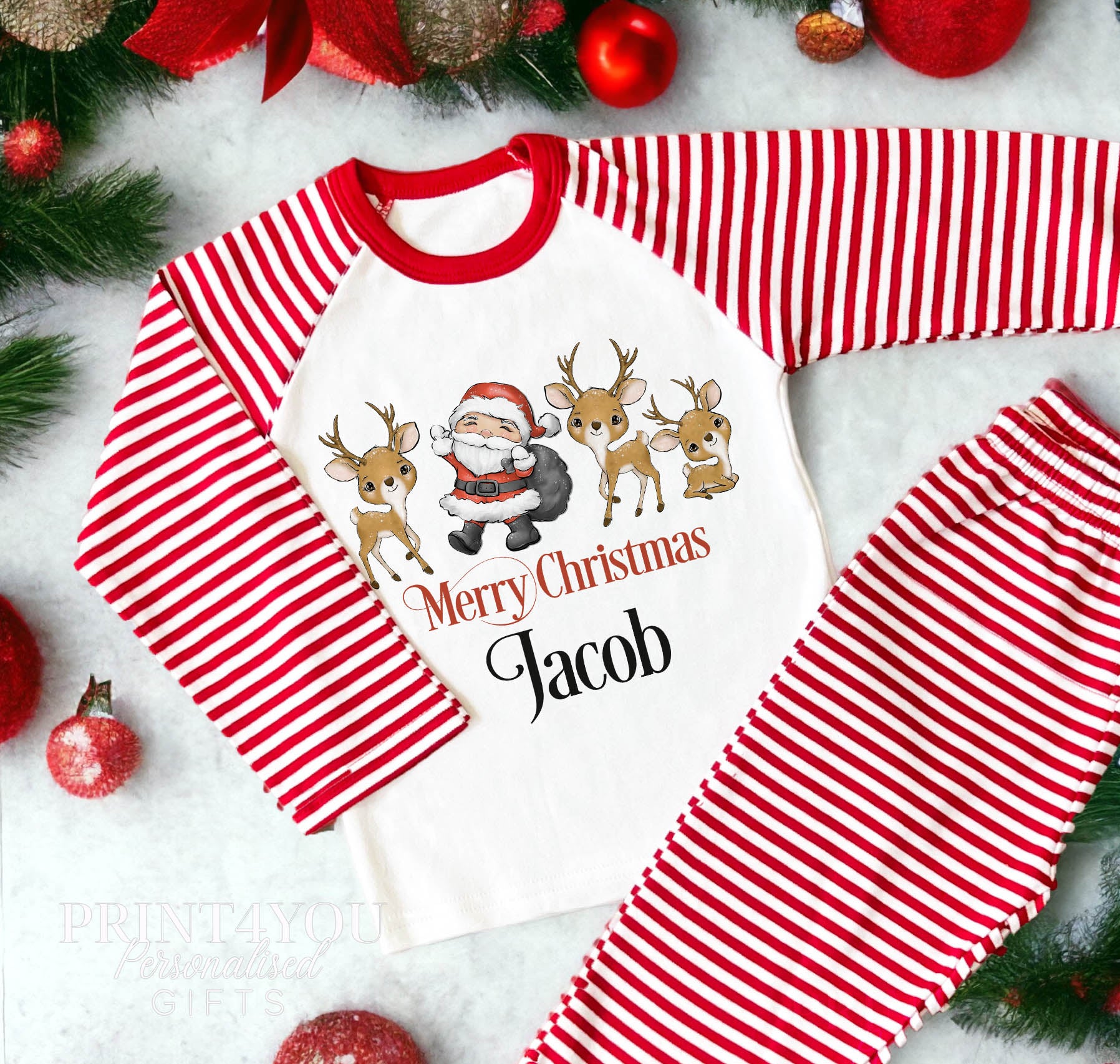 Personalised Merry Christmas pyjamas with Santa, reindeer and a child's name on red and white striped nightwear