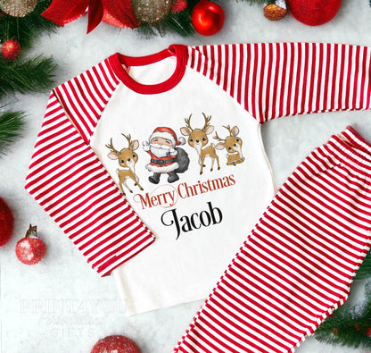 Personalised Merry Christmas pyjamas with Santa, reindeer and a child's name on red and white striped nightwear