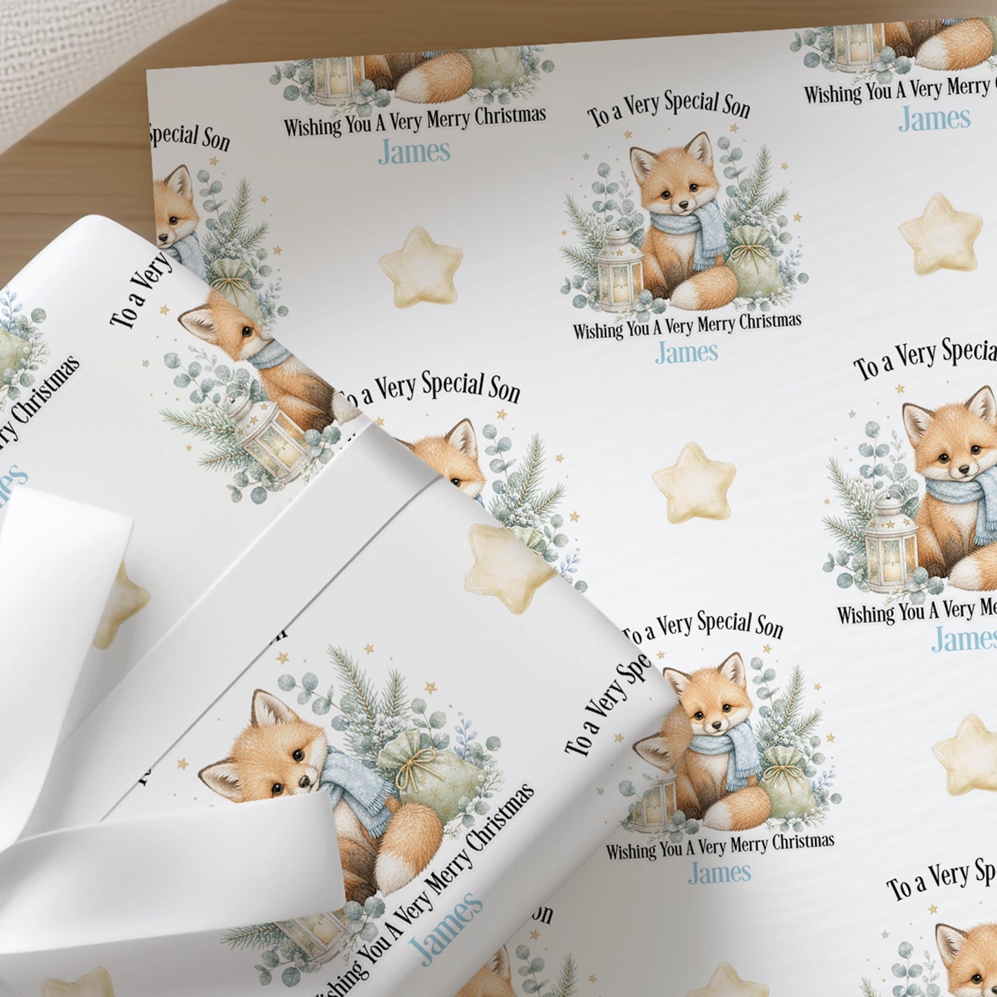 Sheets of the personalised fox Christmas wrapping paper