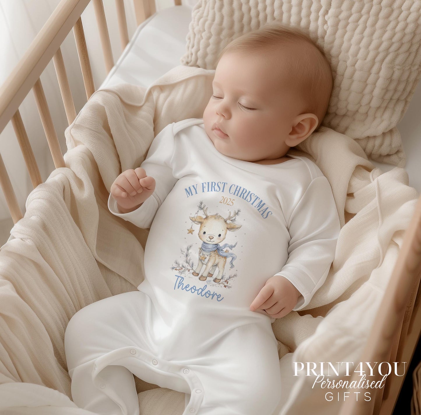 Personalised Christmas baby vest with reindeer design and custom name.
