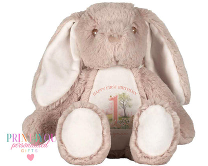 Personalised first birthday plush toy rabbit in pink, approximately 25cm tall, with custom printed tummy design