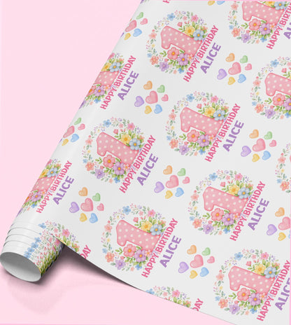 Personalised floral number birthday wrapping paper featuring a large pink floral age number, custom name, colourful flowers and pastel hearts.