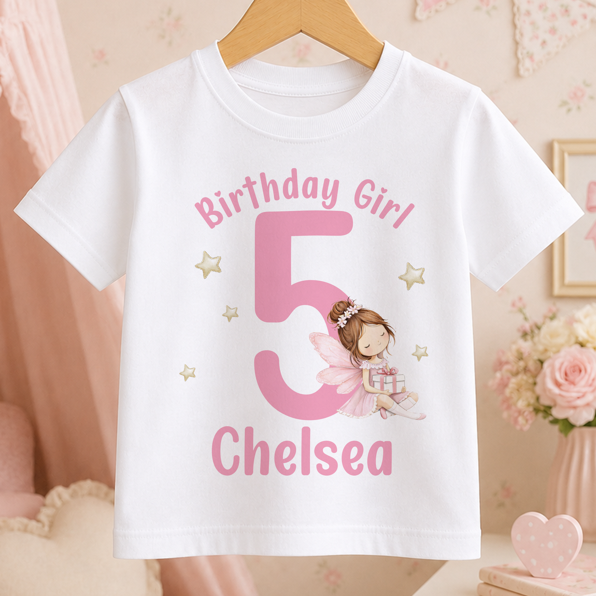 White birthday t-shirt printed with a pink fairy design, a personalised name, and the birthday age