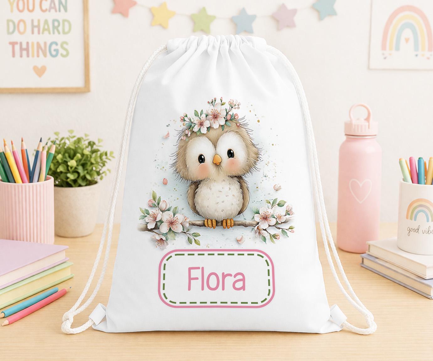 Drawstring PE bag printed with an owl and floral design, personalised with a child's name across the front
