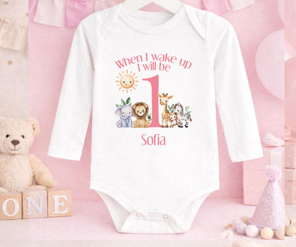 Close-up of the safari design and custom name print on pink 1st birthday pyjamas