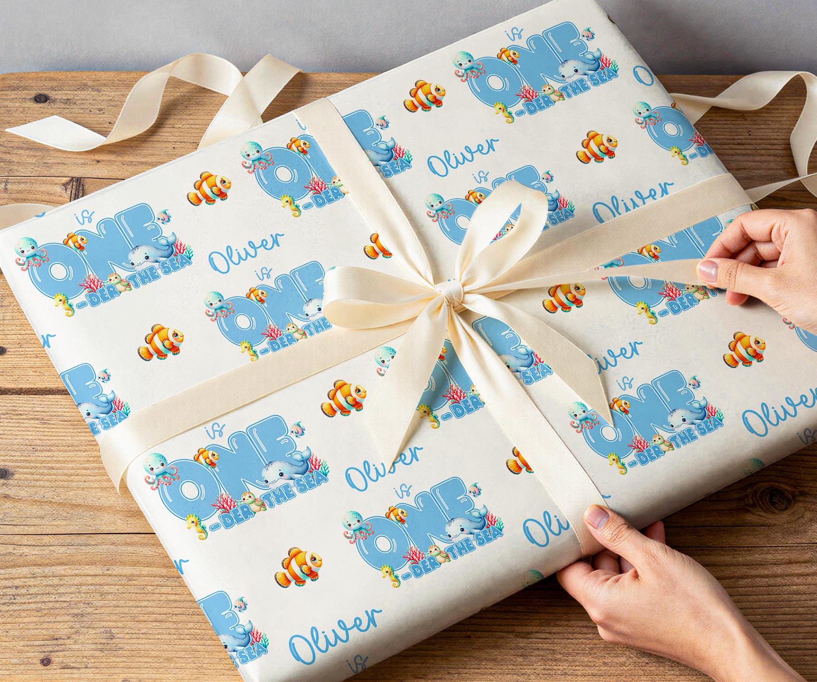 Personalised under the sea wrapping paper rolled and shown against a plain background