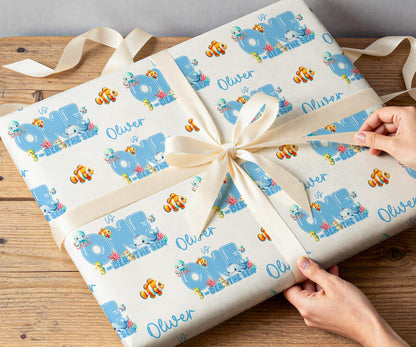 Personalised under the sea wrapping paper rolled and shown against a plain background