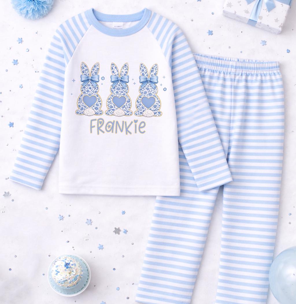 Front view of blue striped bunny pyjamas showing the personalised name print