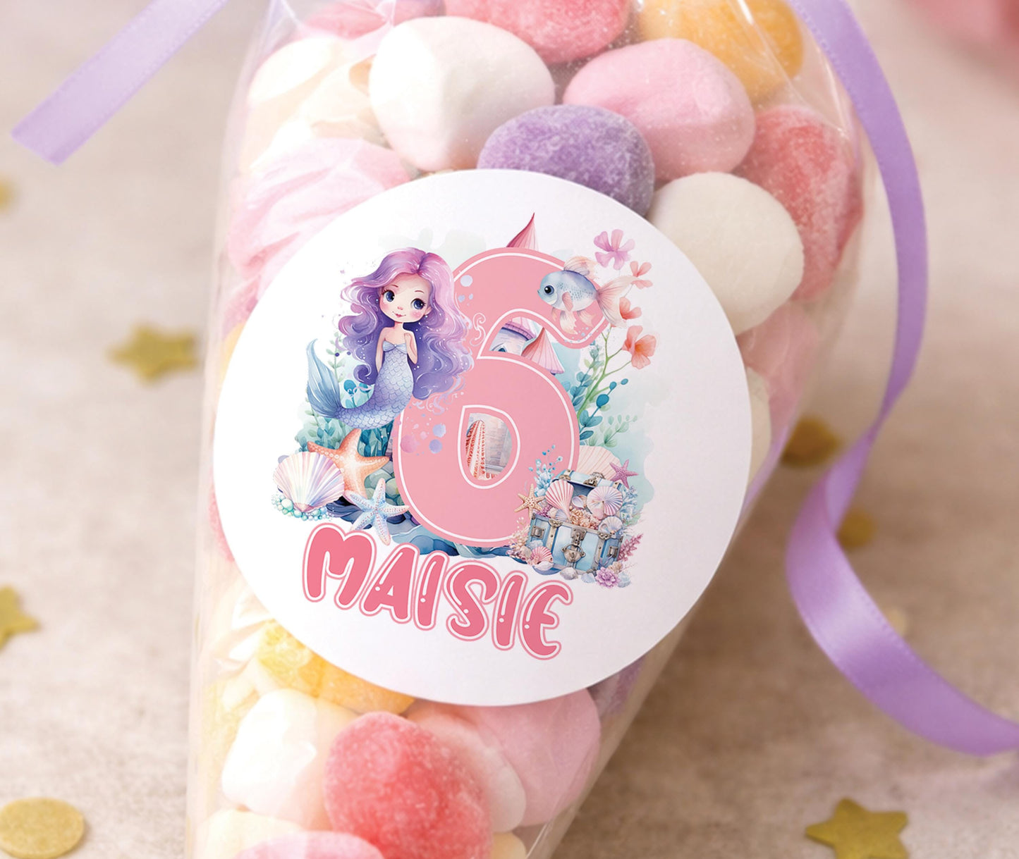 Round glossy stickers featuring a mermaid tail and seashell design, personalised with a birthday child's name