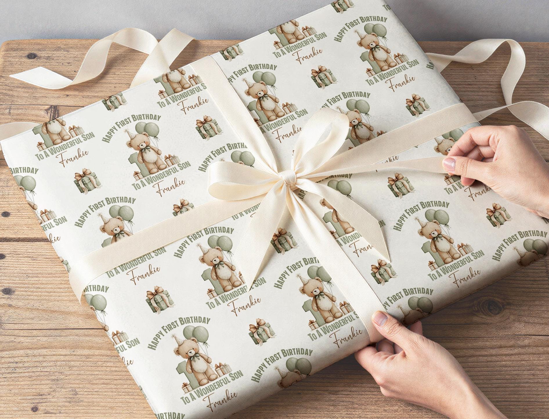 Gift wrapped in the personalised sage green teddy bear birthday paper, tied with ribbon.