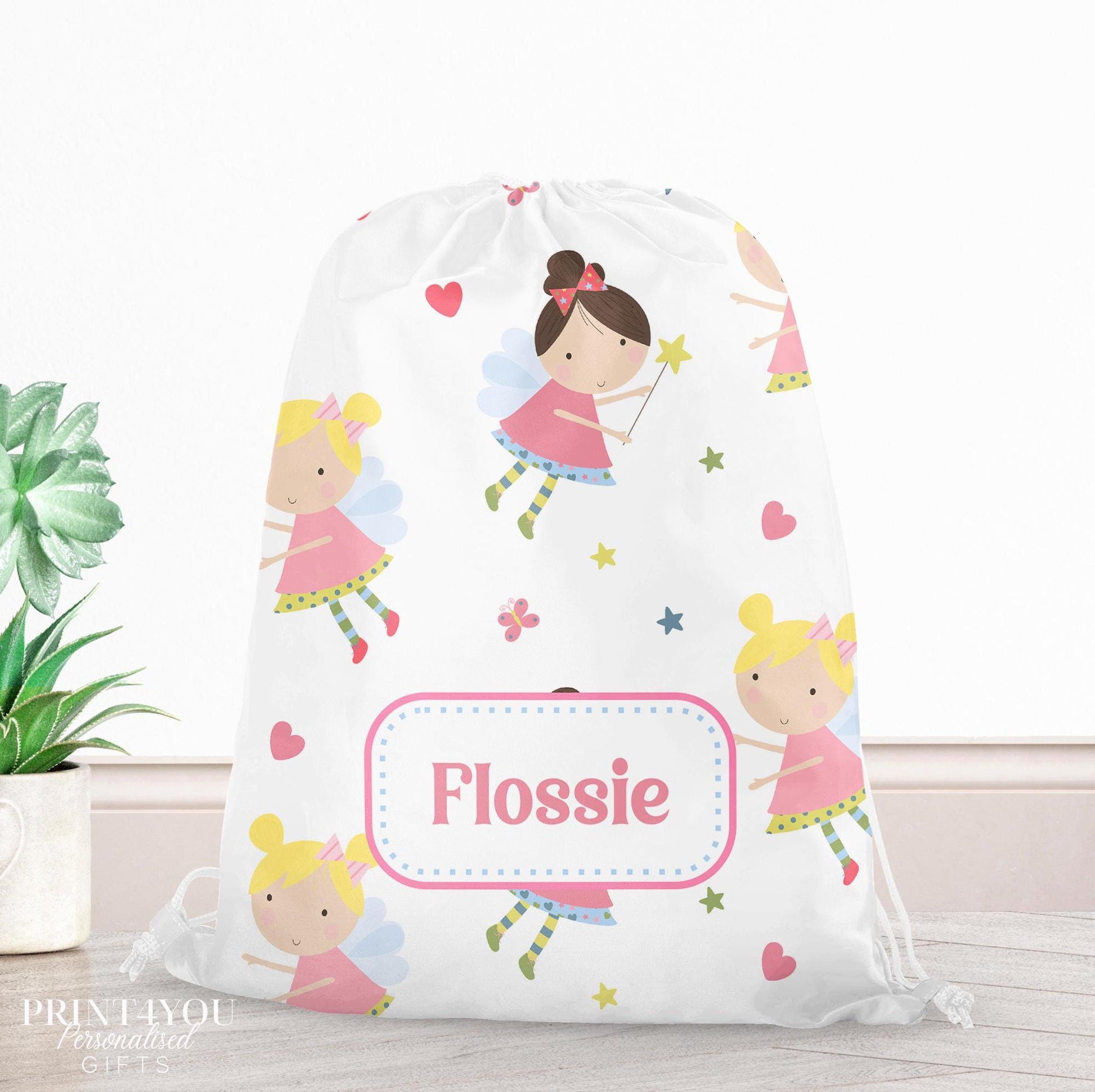 Personalised pastel fairy drawstring bag with wings, stars and hearts, printed with a custom name on the front