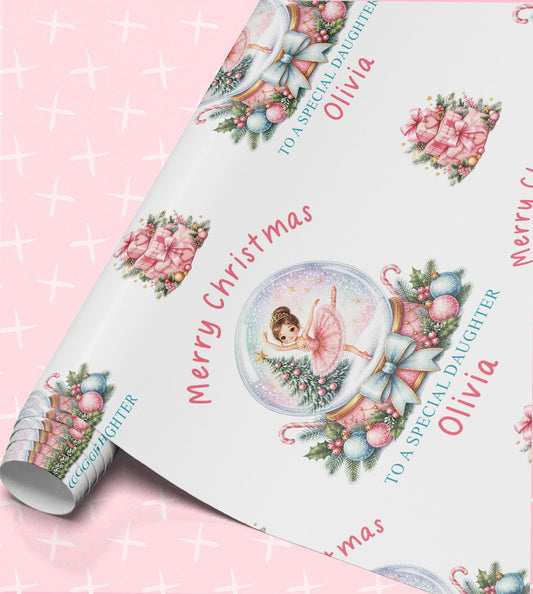 Personalised ballerina Christmas wrapping paper, part-rolled sheet printed with pink snow globes and Merry Christmas with a name
