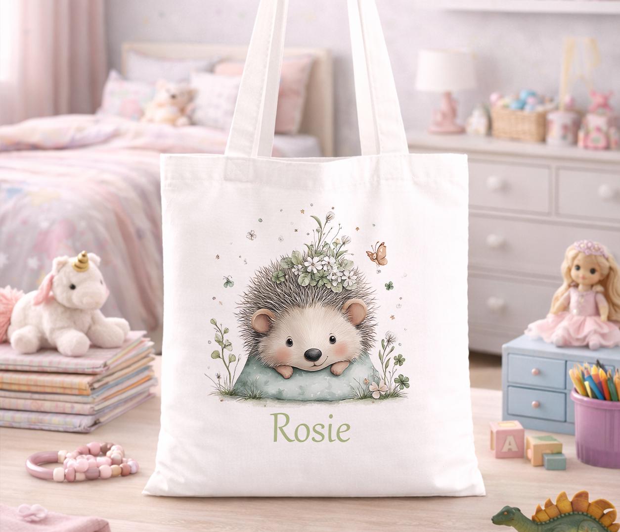 Cream cotton tote bag with a hedgehog and wildflower illustration, personalised with a custom name printed beneath the design