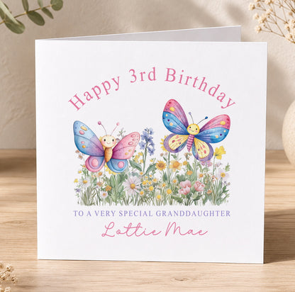Personalised birthday card featuring two colourful butterflies and a floral design, printed with a custom name and age.