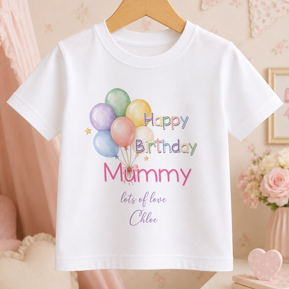 A white t-shirt with a birthday message printed on it, featuring colorful balloons and the text "Happy Birthday Mummy lots of love Chloe".