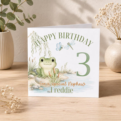 Square greeting card showing the frog birthday card design