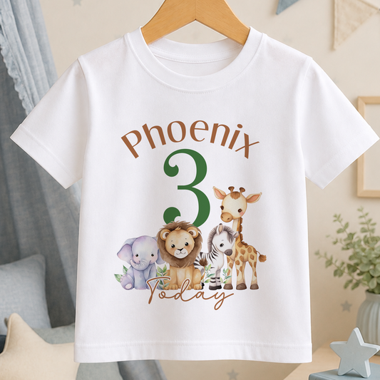A white t-shirt with a graphic design featuring a giraffe, lion, and elephant, along with the text "Phoenix 3 Today".