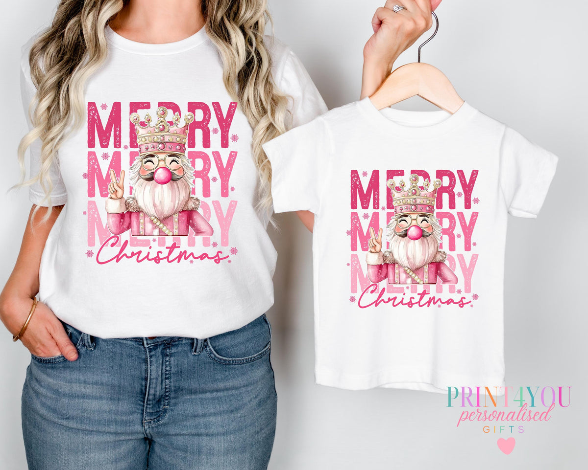 Baby wearing a personalised mummy and me Christmas t-shirt with custom name printed on the front, 0-3 months