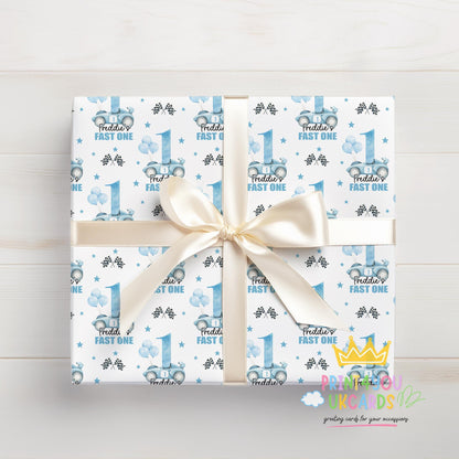 Birthday gift wrapped in the personalised blue racing car wrapping paper with racing flags and stars