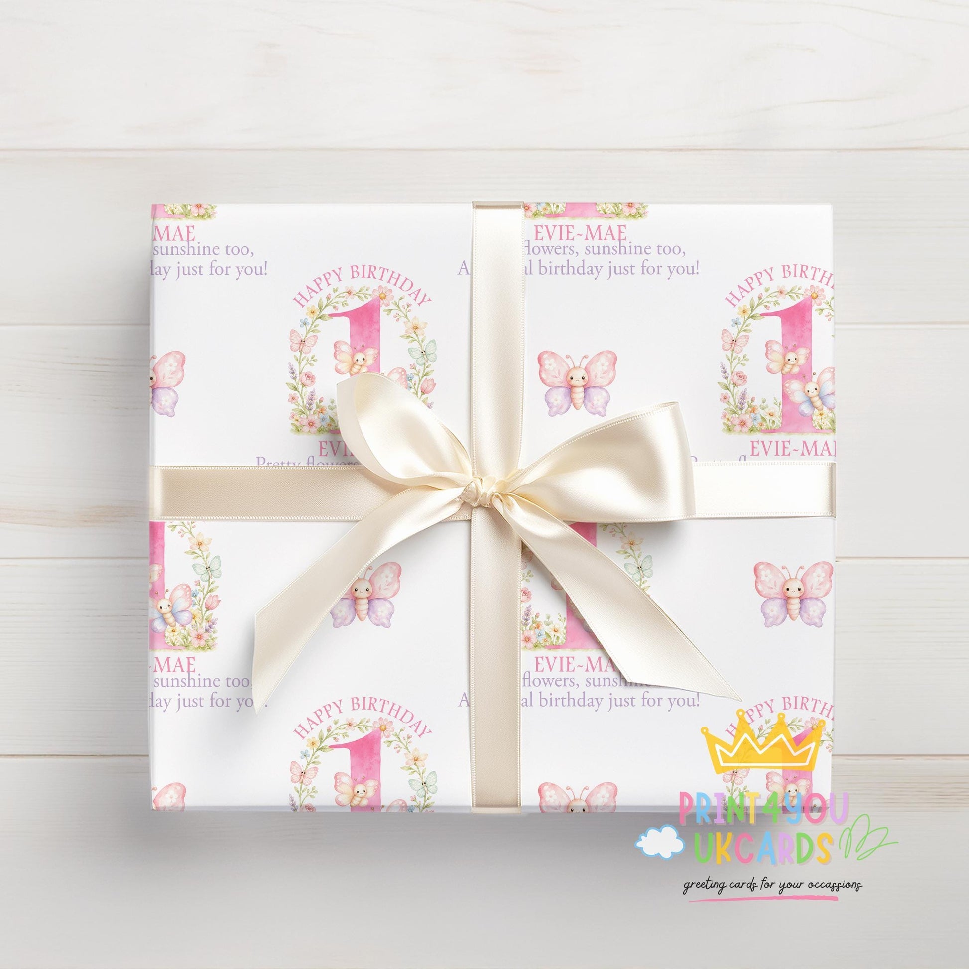 Gift wrapped in the personalised pink butterfly wrapping paper, tied with ribbon.