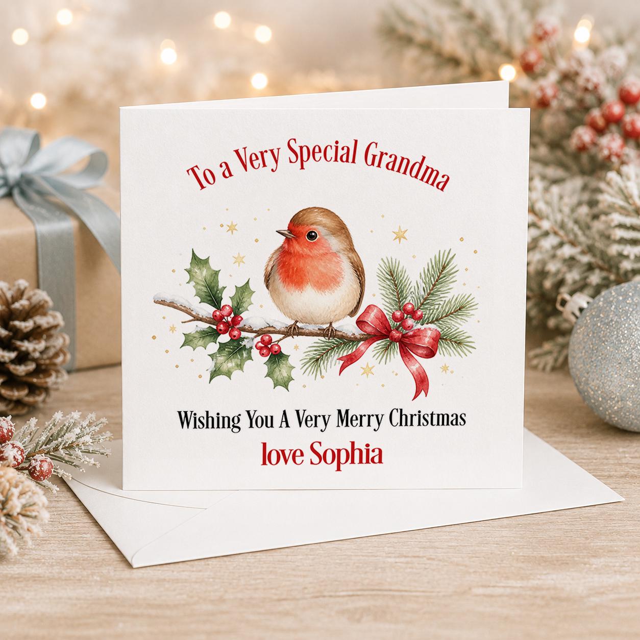 Personalised robin Christmas card, white 6x6 inch square card printed with a robin among holly, berries and red bows with a name