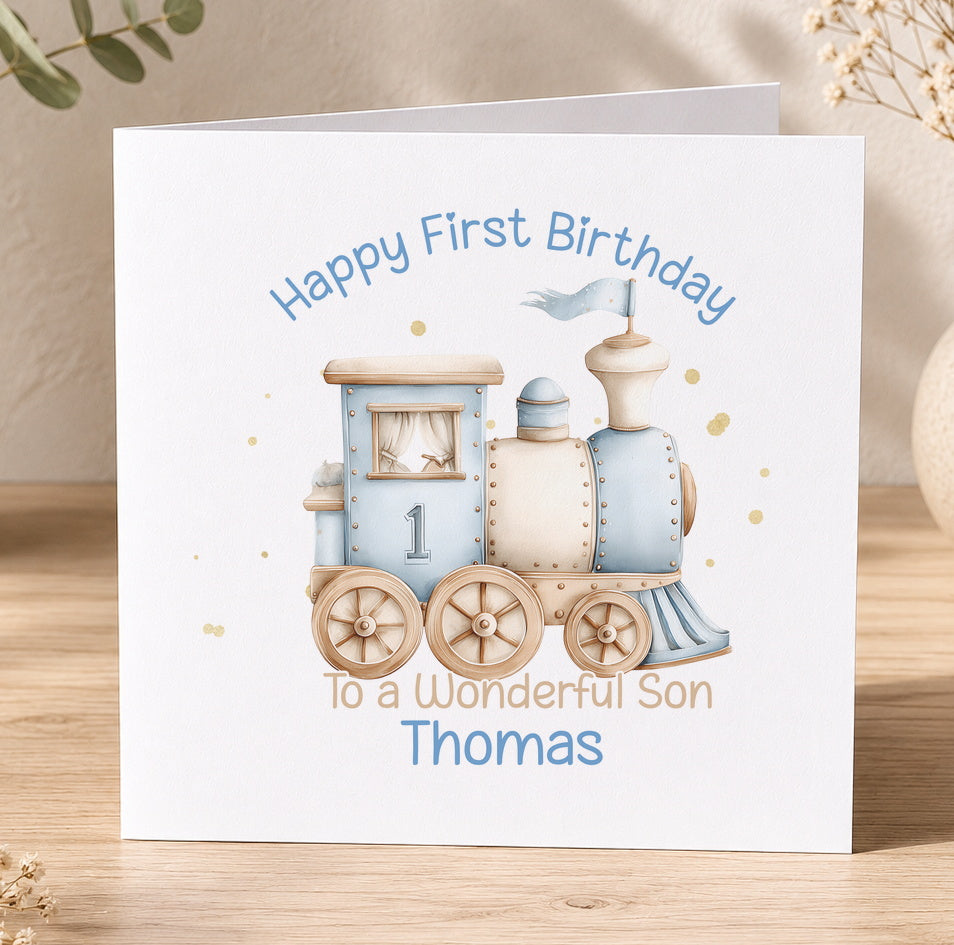 White 1st birthday card with a blue train illustration and the personalised message 'Happy First Birthday To a Wonderful Son Thomas'