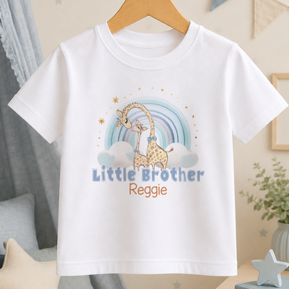 A white t-shirt with a giraffe and a rainbow graphic, along with the text "Little Brother Reggie" printed on it.