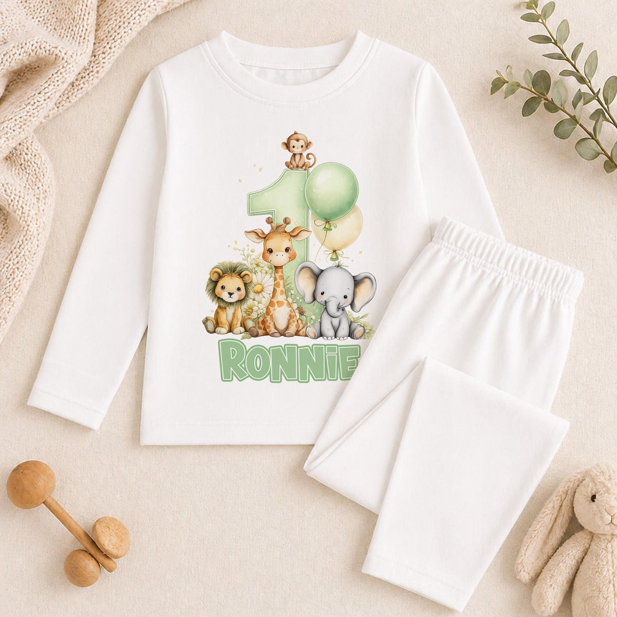 Personalised safari 1st birthday pyjamas with the child's name printed on soft cotton