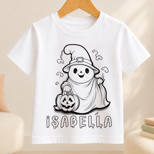 A white t-shirt with a black and white illustration of a ghost character holding a carved pumpkin, with the name "Isabella" written below the image.