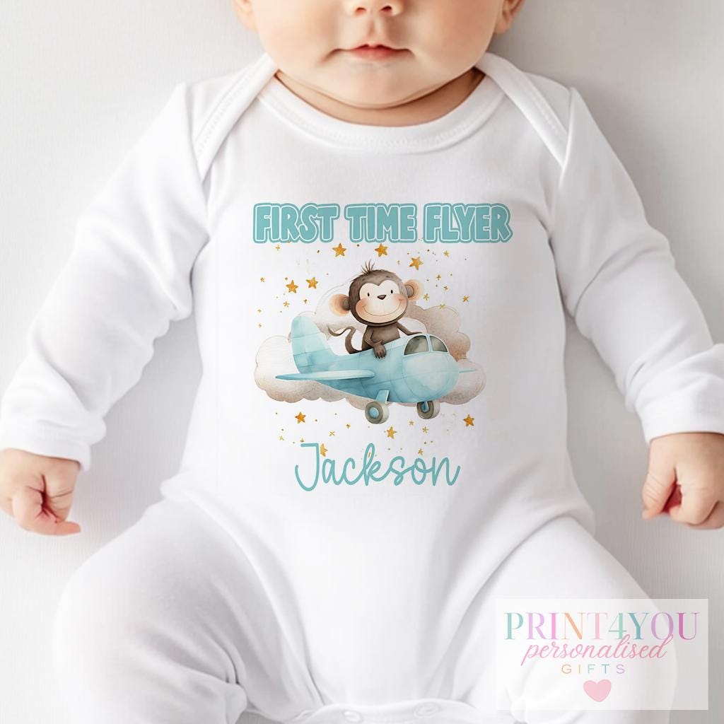 Personalised monkey and aeroplane baby vest, printed with the baby's name for a travel keepsake.